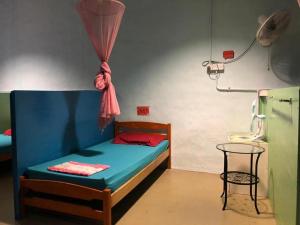 Postel nebo postele na pokoji v ubytování Voyage Guesthouse