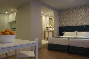 Postel nebo postele na pokoji v ubytování Modo Hotel Apartamento + 31 fotografií