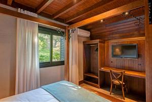 Cama ou camas em um quarto em Hotel Fioreze Chalés