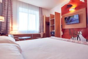 Postel nebo postele na pokoji v ubytování MyContinental Sibiu