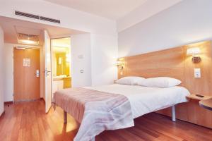 Postel nebo postele na pokoji v ubytování MyContinental Sibiu