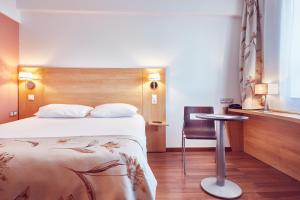 Postel nebo postele na pokoji v ubytování MyContinental Sibiu