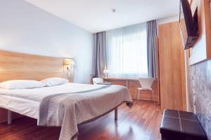 Postel nebo postele na pokoji v ubytování MyContinental Sibiu