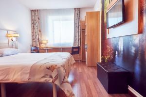TV a/nebo společenská místnost v ubytování MyContinental Sibiu