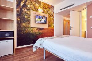 Postel nebo postele na pokoji v ubytování MyContinental Sibiu