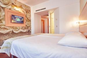 Postel nebo postele na pokoji v ubytování MyContinental Sibiu