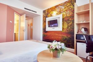 Postel nebo postele na pokoji v ubytování MyContinental Sibiu
