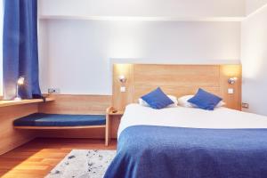 Postel nebo postele na pokoji v ubytování MyContinental Sibiu
