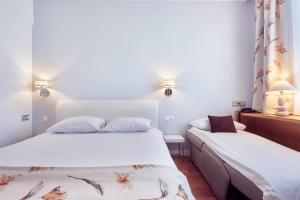 Postel nebo postele na pokoji v ubytování MyContinental Sibiu