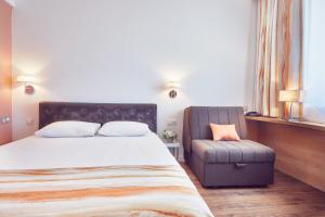 Postel nebo postele na pokoji v ubytování MyContinental Sibiu