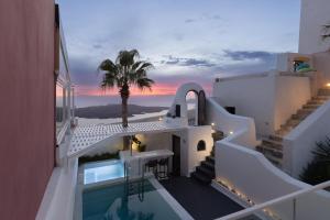 A view of the pool at Opera Mansion Santorini or nearby
