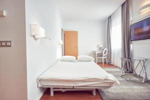 Postel nebo postele na pokoji v ubytování MyContinental Sibiu