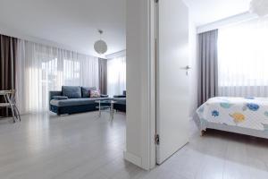 Postel nebo postele na pokoji v ubytování Resort Apartamenty Klifowa Rewal 19 + 37 fotografií