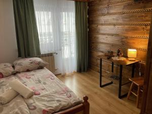 Posteľ alebo postele v izbe v ubytovaní Willa Dziubas z jacuzzi & sauną