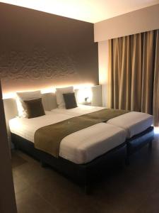 Кровать или кровати в номере Hotel Gemeente Huis