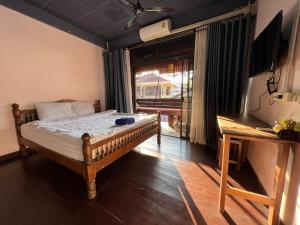 Postel nebo postele na pokoji v ubytování Madera House Chiang Mai