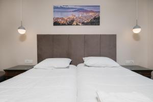 Postel nebo postele na pokoji v ubytování Tesoro Hotel Zakynthos