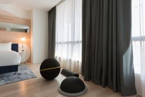 Postel nebo postele na pokoji v ubytování voco Milan-Fiere by IHG