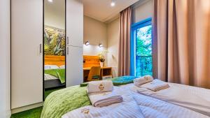 Posteľ alebo postele v izbe v ubytovaní Apartamenty VIP Centrum - Wczasowa 17 by Royal Aparts