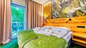Posteľ alebo postele v izbe v ubytovaní Apartamenty VIP Centrum - Wczasowa 17 by Royal Aparts