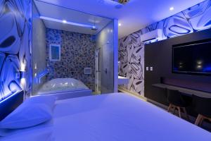 Postel nebo postele na pokoji v ubytování Drops Motel Manaus + 35 fotografií