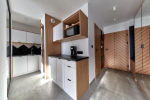 Kuchyň nebo kuchyňský kout v ubytování Tatra Square Apartments