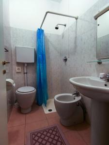a bathroom with a toilet and a sink at Albergo Anita in San Bartolomeo al Mare