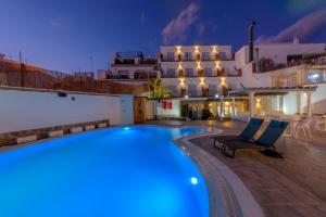 a swimming pool in front of a building at Hotel Boutique Sibarys - Adults Recommended in Nerja