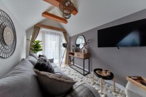 TV a/nebo společenská místnost v ubytování Tatra Square Apartments