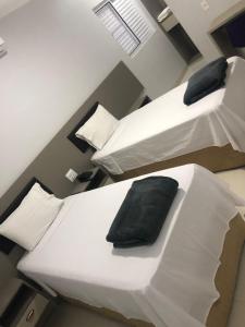 Hotel Uipi tesisinde bir odada yatak veya yataklar