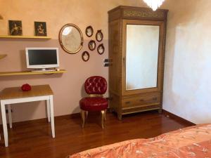 a bedroom with a bed and a desk with a computer at B&B Guarini in Casamassima
