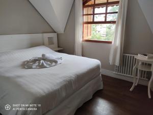 Postel nebo postele na pokoji v ubytování Pousada Château dos Fontes