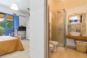 a bathroom with a shower and a toilet and a sink at DIMORA FEO in Gallipoli +42 photos