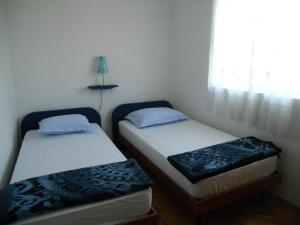 Postel nebo postele na pokoji v ubytování Apartment Guste