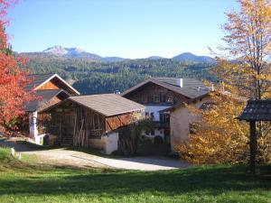 a group of buildings with mountains in the background at Schornhof in Aldino