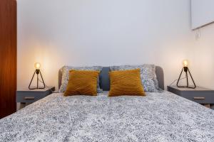 Posteľ alebo postele v izbe v ubytovaní St. Florian cozy loft