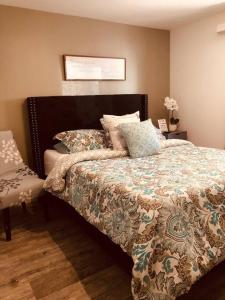 a bedroom with a bed with a blanket and pillows at Sedona Vista To Red Rock pets friendly and Hot Tub coming MAY! in Sedona