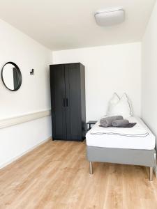 Postel nebo postele na pokoji v ubytování Hegau Boardinghouse