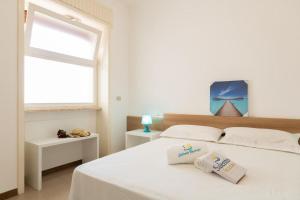 Postel nebo postele na pokoji v ubytování VILLA ISCHIA