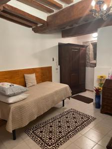 A bed or beds in a room at Affittacamere Mirella