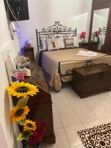 A bed or beds in a room at Affittacamere Mirella