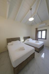 Postel nebo postele na pokoji v ubytování Manazil Mani - Luxury Villas