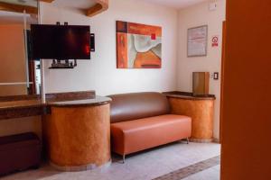 TV a/nebo společenská místnost v ubytování Motel Primavera + 15 fotografií