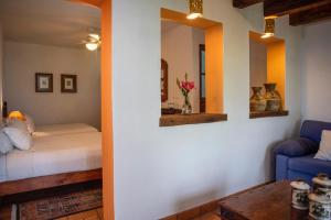 Postel nebo postele na pokoji v ubytování El Alcazar