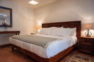 Postel nebo postele na pokoji v ubytování El Alcazar