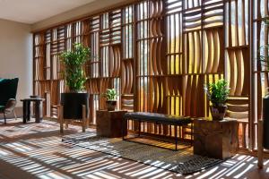 a lobby with wooden walls and potted plants at The Wilde Resort and Spa in Sedona