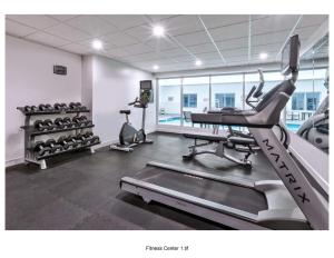 a gym with a treadmill and elliptical machines at Staybridge Suites Pittsburgh Airport by IHG in Beechcliff