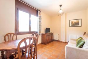 TV a/nebo společenská místnost v ubytování Apart-Hotel Selva Nevada