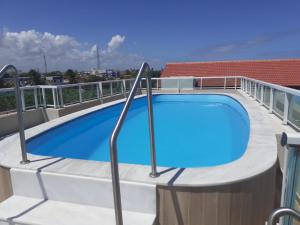 a swimming pool on the roof of a building at Studio Moah 205_Porto de Galinhas in Porto De Galinhas
