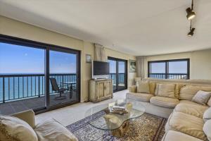 a living room with a couch and a tv at Sea Watch Condos IV in Ocean City